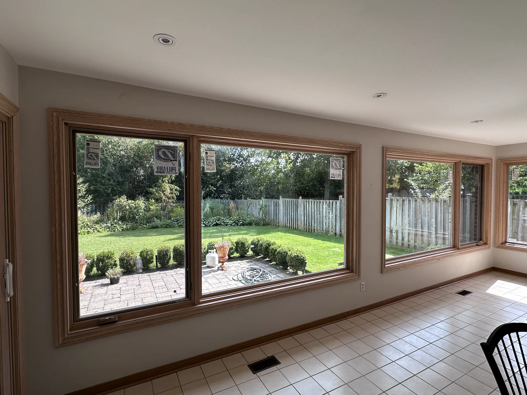 Bright sunroom with a newly installed wall of windows