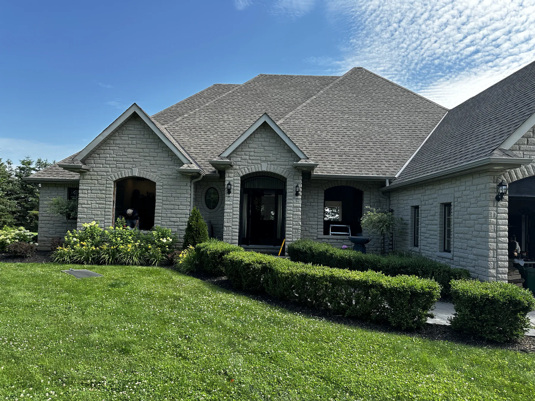 Stone bungalow after a whole-home window replacement